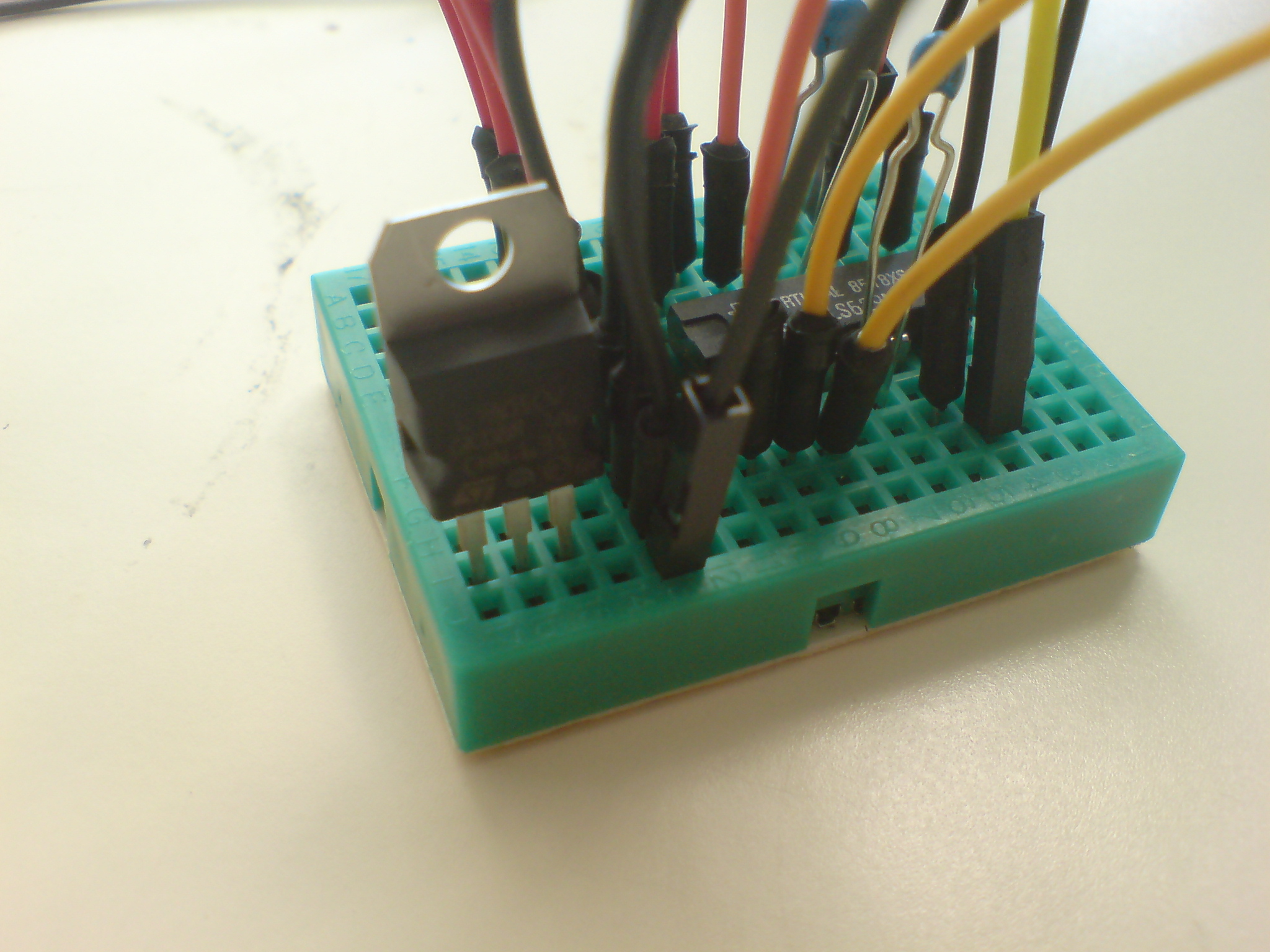 Attach regulator to breadboard - metal site away from yourself